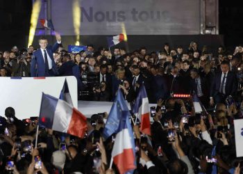 French President and La Republique en Marche (LREM) party candidate for re-election Emmanuel Macron celebrates after his victory in France's presidential election, at the Champ de Mars in Paris, on April 24, 2022. (Photo by Ludovic MARIN / AFP)